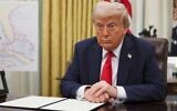 US President Donald Trump listens to a question from a reporter before signing an executive order in the Oval Office of the White House in Washington, March 31, 2025. (Pool via AP)