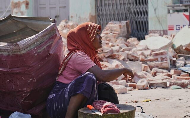 A beef vendor waits for customers at a local bazaar near a building damaged by the earthquake in Naypyitaw, Myanmar, Tuesday, April 1, 2025. (AP Photo) A beef vendor waits for customers at a local bazaar near a building damaged by the earthquake in Naypyitaw, Myanmar, Tuesday, April 1, 2025. (AP Photo)