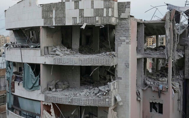 Damaged apartment buildings are seen after being struck earlier by an Israeli attack in Dahiyeh, a southern suburb of Beirut, Lebanon, early Tuesday, April 1, 2025. (AP Photo/Hussein Malla)