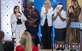 Former hostage Amit Soussana, left, holds her hands over her heart while being applauded after speaking during the International Women of Courage awards ceremony, next to Henriette Da, of Burkina Faso, Georgiana Pascu, of Romania, Major Velena Iga, of Papua New Guinea, and first lady Melania Trump, at the award ceremony, Tuesday, April 1, 2025, at the State Department in Washington. S (AP Photo/Jacquelyn Martin)