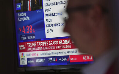 Traders work on the floor at the New York Stock Exchange in New York, Thursday, April 3, 2025. (AP/Seth Wenig)