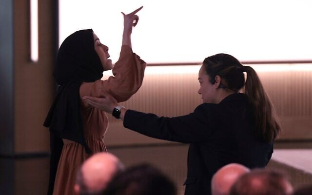A pro-Palestinian protester against Israel is escorted away by security while interrupting Microsoft AI CEO Mustafa Suleyman during a presentation of the company's AI assistant, Copilot, ahead of a 50th Anniversary presentation at Microsoft headquarters, April 4, 2025, in Redmond, Washington. (AP Photo/Jason Redmond) A pro-Palestinian protester against Israel is escorted away by security while interrupting Microsoft AI CEO Mustafa Suleyman during a presentation of the company's AI assistant, Copilot, ahead of a 50th Anniversary presentation at Microsoft headquarters, April 4, 2025, in Redmond, Washington. (AP Photo/Jason Redmond)