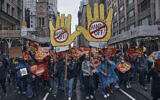 People march in a 'Hands Off!' protest against US President Donald Trump in New York, April 5, 2025. (AP/Andres Kudacki)