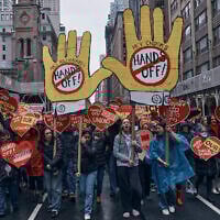 People march in a 'Hands Off!' protest against US President Donald Trump in New York, April 5, 2025. (AP/Andres Kudacki)