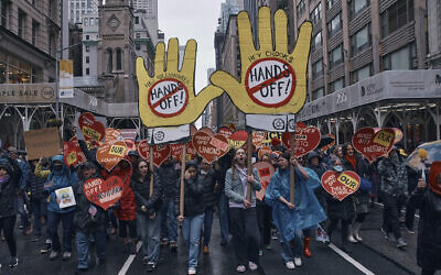 People march in a 'Hands Off!' protest against US President Donald Trump in New York, April 5, 2025. (AP/Andres Kudacki)