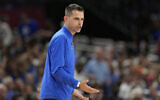 Florida head coach Todd Golden gestures to his team during the second half in the national semifinals at the Final Four of the NCAA college basketball tournament, in San Antonio, April 5, 2025. (Eric Gay/AP)