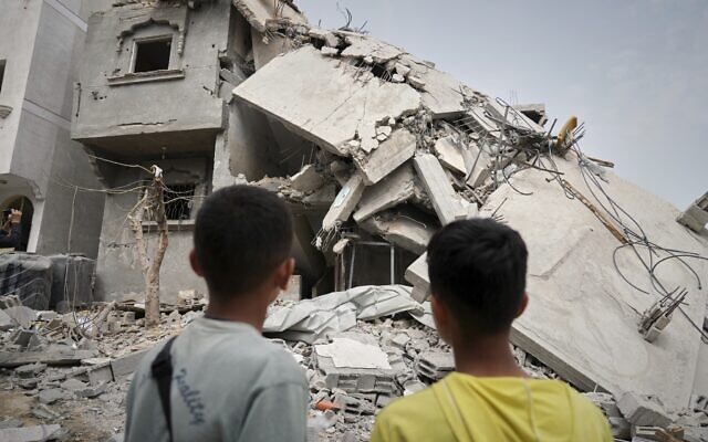 Children look at the destroyed house of journalist Islam Meqdad, where she was killed along with her son and five other family members in an Israeli army strike in Khan Younis, southern Gaza Strip, April 6, 2025. (AP Photo/Abdel Kareem Hana) Children look at the destroyed house of journalist Islam Meqdad, where she was killed along with her son and five other family members in an Israeli army strike in Khan Younis, southern Gaza Strip, April 6, 2025. (AP Photo/Abdel Kareem Hana)