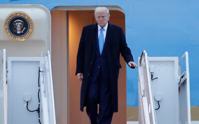 US President Donald Trump walks down the stairs of Air Force One upon his arrival at Joint Base Andrews, Maryland, April 6, 2025. (Luis M. Alvarez/AP)