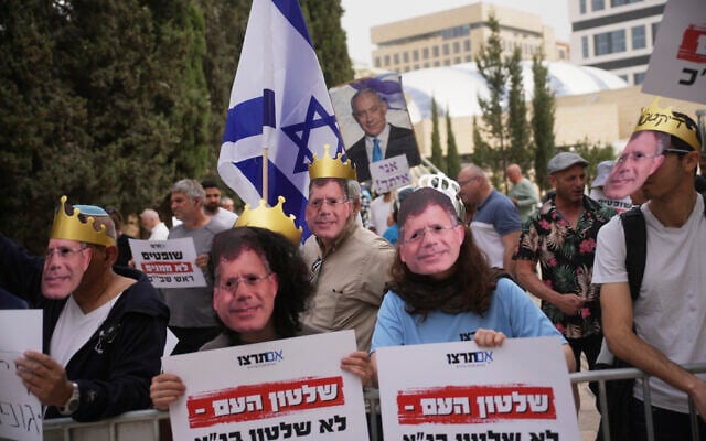Activists hold posters with writing reading "Rule of the people Not rule of the High Court" as they stage a demonstration against the power of the judiciary outside the Supreme Court in Jerusalem on Tuesday, April 8, 2025. (AP/Ohad Zwigenberg)