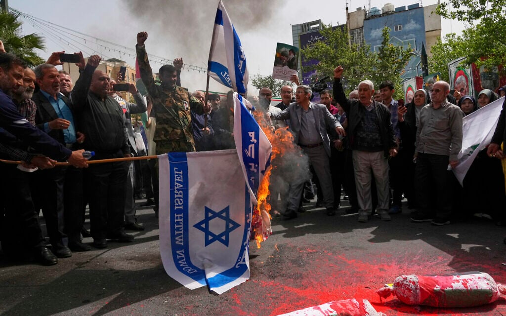 Iranian protesters burn representations of the Israeli flag during a demonstration at Palestine Square in Tehran, Iran, April 9, 2025. (AP Photo/Vahid Salemi)