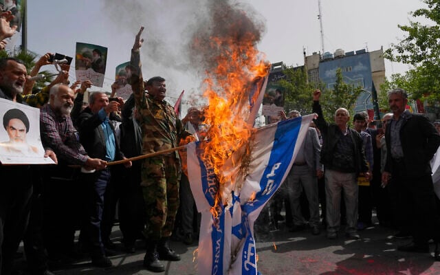 Iranian protesters burn representations of the Israeli flag during a demonstration at Palestine Square in Tehran, Iran, April 9, 2025. (AP Photo/Vahid Salemi)