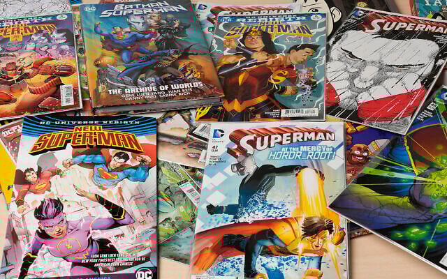 Comic books are displayed in Gene Yang's home on April 1, 2025, in San Jose, California (AP Photo/Tony Avelar)