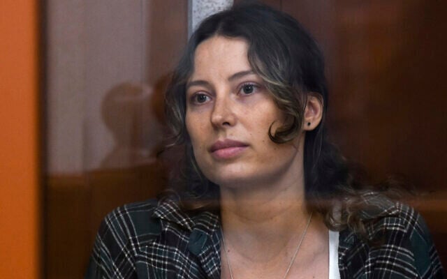 Ksenia Karelina sits in a glass cage in a court room in Yekaterinburg, Russia, Thursday, June 20, 2024. (AP Photo, File)