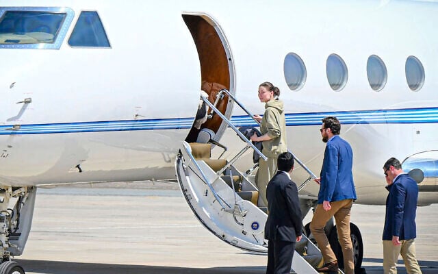 This photo released by the state-run WAM news agency shows US-Russian dual national Ksenia Karelina getting on a private jet after her release at an airport in Abu Dhabi, United Arab Emirates, April 10, 2025. (WAM via AP)
