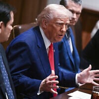 US President Donald Trump speaks as his Secretary of State Marco Rubio, from left, Defense Secretary Pete Hegseth and Commerce Secretary Howard Lutnick listen during a cabinet meeting in the Cabinet Room of the White House in Washington, April 10, 2025. (Pool via AP)