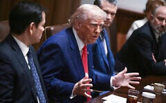 US President Donald Trump speaks as his Secretary of State Marco Rubio, from left, Defense Secretary Pete Hegseth and Commerce Secretary Howard Lutnick listen during a cabinet meeting in the Cabinet Room of the White House in Washington, April 10, 2025. (Pool via AP)