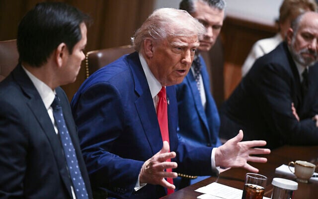 US President Donald Trump speaks as his Secretary of State Marco Rubio, from left, Defense Secretary Pete Hegseth and Commerce Secretary Howard Lutnick listen during a cabinet meeting in the Cabinet Room of the White House in Washington, April 10, 2025. (Pool via AP)
