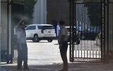 Omani security personnel watch a convoy believed to be carrying US Mideast envoy Steve Witkoff in Muscat, Oman, April 12, 2025. (AP Photo/Fatima Shbair)