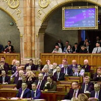 Hungary’s parliament has passed an amendment to the constitution that allows the government to ban public events by LGBTQ+ communities, in Budapest, Hungary, Monday, April 14, 2025. (Robert Hegedus/MTI via AP)