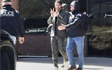 This image taken from a video provided by Christopher Helali shows Mohsen Mahdawi, an anti-Israel protest leader at Columbia University, being detained at the US Citizenship and Immigration Services office in Colchester, Vt., April 14, 2025. (Christopher Helali via AP)
