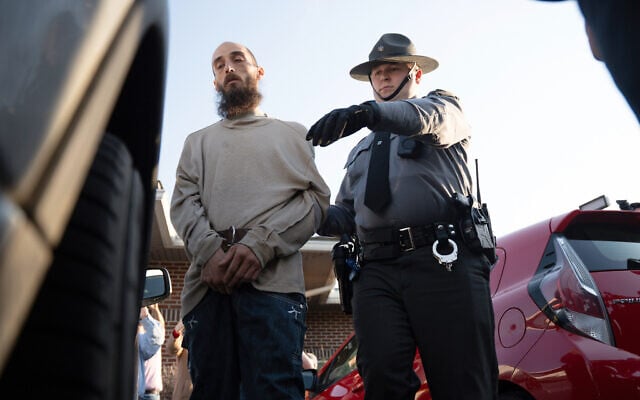 Cody Balmer (left) is escorted from court after his preliminary arraignment on April 14, 2025, in Harrisburg, Pa. (AP Photo/Mingson Lau)