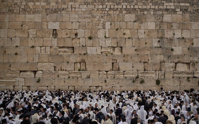 Covered in prayer shawls, Jewish men of the Cohanim priestly caste participate in a blessing during the holiday of Passover, at the Western Wall in the Old City of Jerusalem, Tuesday, April 15, 2025. (AP Photo/Leo Correa) Covered in prayer shawls, Jewish men of the Cohanim priestly caste participate in a blessing during the holiday of Passover, at the Western Wall in the Old City of Jerusalem, Tuesday, April 15, 2025. (AP Photo/Leo Correa)