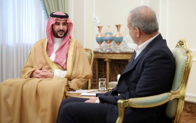 Saudi Arabia's Defense Minister Prince Khalid bin Salman, left, speaks with President Masoud Pezeshkian during their meeting, in Tehran, Iran, April 17, 2025. (Iranian Presidency Office via AP)