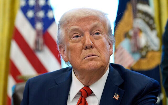 US President Donald Trump speaks as he signs executive orders in the Oval Office of the White House on April 17, 2025, in Washington. (AP Photo/Alex Brandon)