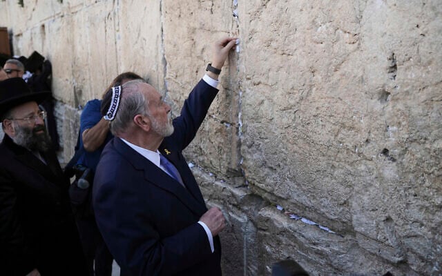 US ambassador to Israel, Mike Huckabee, places a note on behalf of US President Donald Trump at the Western Wall, in the Old City of Jerusalem, April 18, 2025. (AP Photo/Leo Correa) US ambassador to Israel, Mike Huckabee, places a note on behalf of US President Donald Trump at the Western Wall, in the Old City of Jerusalem, April 18, 2025. (AP Photo/Leo Correa)
