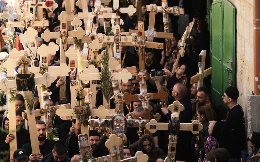 Christian pilgrims carry crosses during Good Friday procession in the Old City of Jerusalem, April 18, 2025. (AP Photo/Mahmoud Illean)