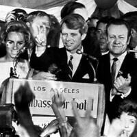 Sen. Robert F. Kennedy, D-N.Y., speaks to campaign workers, June 5, 1968, as his wife Ethel, left, and California campaign manager and speaker of the California Assembly, Jesse Unruh, look on, at the Ambassador Hotel in Los Angeles. (AP Photo)