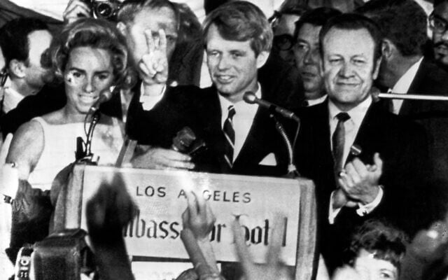 Sen. Robert F. Kennedy, D-N.Y., speaks to campaign workers, June 5, 1968, as his wife Ethel, left, and California campaign manager and speaker of the California Assembly, Jesse Unruh, look on, at the Ambassador Hotel in Los Angeles. (AP Photo)