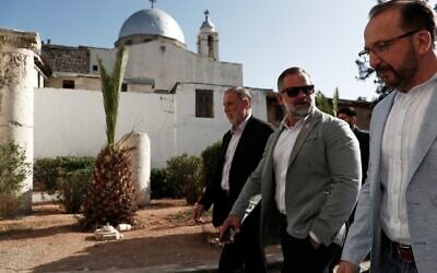 Accompanied by unidentified members of the delegation, U.S. congressman Cory Mills (R-FL), second from right, walks in the Old City of Damascus Friday, April 18, 2025. (AP Photo/Omar Sanadiki)