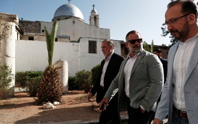 Accompanied by unidentified members of the delegation, U.S. congressman Cory Mills (R-FL), second from right, walks in the Old City of Damascus Friday, April 18, 2025. (AP Photo/Omar Sanadiki)
