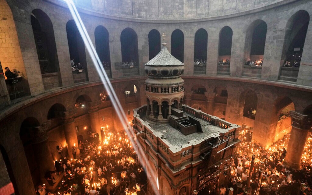 Christian pilgrims light candles during the Holy Fire ceremony, at the Church of the Holy Sepulcher, the site where according to tradition Jesus was crucified and buried, in Jerusalem's Old City, Saturday, April 19, 2025. (AP Photo/Mahmoud Illean)