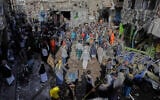 Yemenis at the site of a US airstrike in Sanaa, Yemen, April 21, 2025. (AP)
