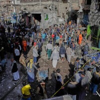 Yemenis at the site of a US airstrike in Sanaa, Yemen, April 21, 2025. (AP)