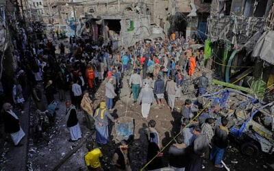 Yemenis at the site of a US airstrike in Sanaa, Yemen, April 21, 2025. (AP)
