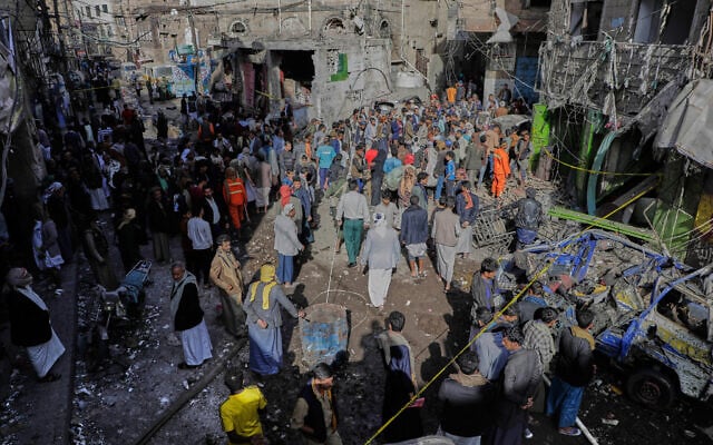 Yemenis at the site of a US airstrike in Sanaa, Yemen, April 21, 2025. (AP)
