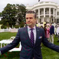 US Defense Secretary Pete Hegseth speaks with reporters on the South Lawn of the White House before US President Donald Trump and First Lady Melania Trump participate in the White House Easter Egg Roll in Washington, April 21, 2025. (AP Photo/Alex Brandon)