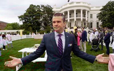 US Defense Secretary Pete Hegseth speaks with reporters on the South Lawn of the White House before US President Donald Trump and First Lady Melania Trump participate in the White House Easter Egg Roll in Washington, April 21, 2025. (AP Photo/Alex Brandon)