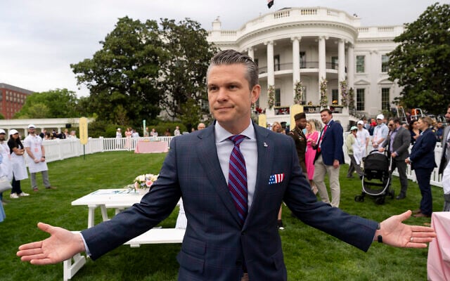 US Defense Secretary Pete Hegseth speaks with reporters on the South Lawn of the White House before US President Donald Trump and First Lady Melania Trump participate in the White House Easter Egg Roll in Washington, April 21, 2025. (AP Photo/Alex Brandon)