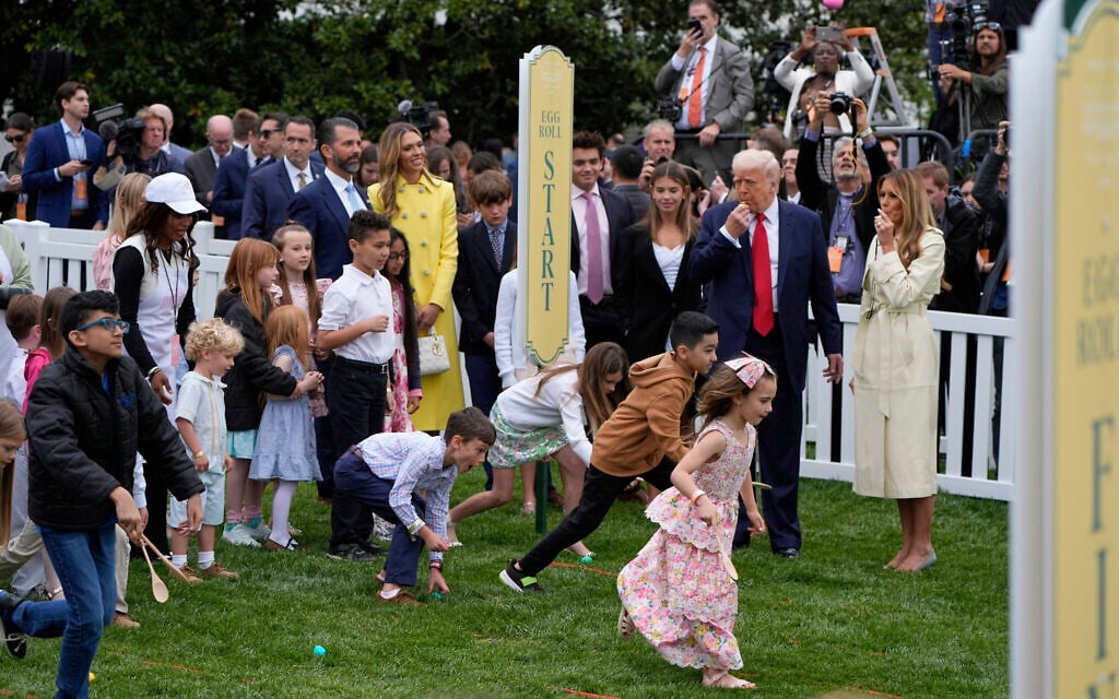 President Donald Trump and first lady Melania Trump blow whistles during the White House Easter Egg Roll on the South Lawn of the White House, Monday, April 21, 2025, in Washington. (AP Photo/Alex Brandon)