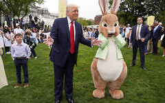 US President Donald Trump stands with the Easter bunny as he participates in the White House Easter Egg Roll on the South Lawn of the White House, Monday, April 21, 2025, in Washington. (AP Photo/Mark Schiefelbein)