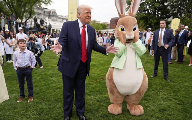 US President Donald Trump stands with the Easter bunny as he participates in the White House Easter Egg Roll on the South Lawn of the White House, Monday, April 21, 2025, in Washington. (AP Photo/Mark Schiefelbein)