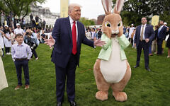 US President Donald Trump, left, stands with the Easter bunny during the the White House Easter Egg Roll on the South Lawn of the White House in Washington, April 21, 2025. (AP Photo/Mark Schiefelbein)
