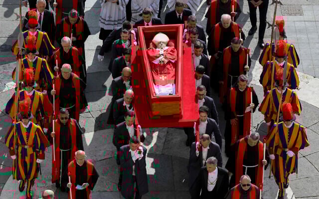 The body of late Pope Francis is carried in an open coffin through St. Peter's Square to St. Peter's Basilica at the Vatican on Wednesday, April 23, 2025, where the deceased pontiff will lie in state for three days. (Vatican Media via AP)
