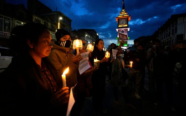 People hold candles during a candlelight protest in Srinagar, Indian controlled Kashmir, April 23, 2025, a day after an attack killed at least 26 people, most of them tourists. (AP/Mukhtar Khan) People hold candles during a candlelight protest in Srinagar, Indian controlled Kashmir, April 23, 2025, a day after an attack killed at least 26 people, most of them tourists. (AP/Mukhtar Khan)