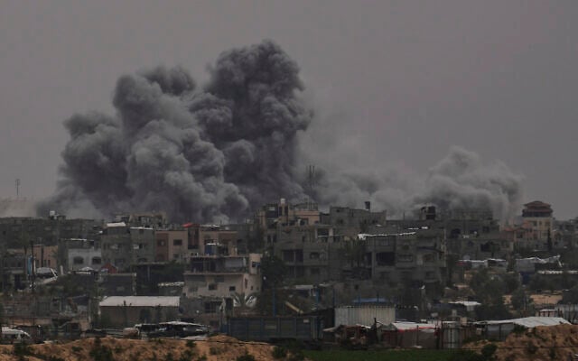 Smoke rises to the sky following an Israeli strike in Khan Younis, Gaza Strip, Thursday, April 24, 2025. (AP Photo/Abdel Kareem Hana)