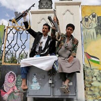 Houthi supporters chant slogans in front of banners supporting Palestinians, during anti-US and anti-Israel rally in Sanaa, Yemen, April 25, 2025. (AP Photo/Osamah Abdulrahman)